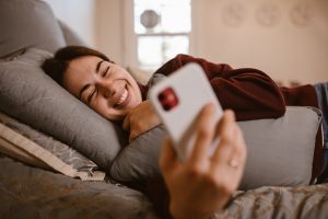 Woman smile with her phone